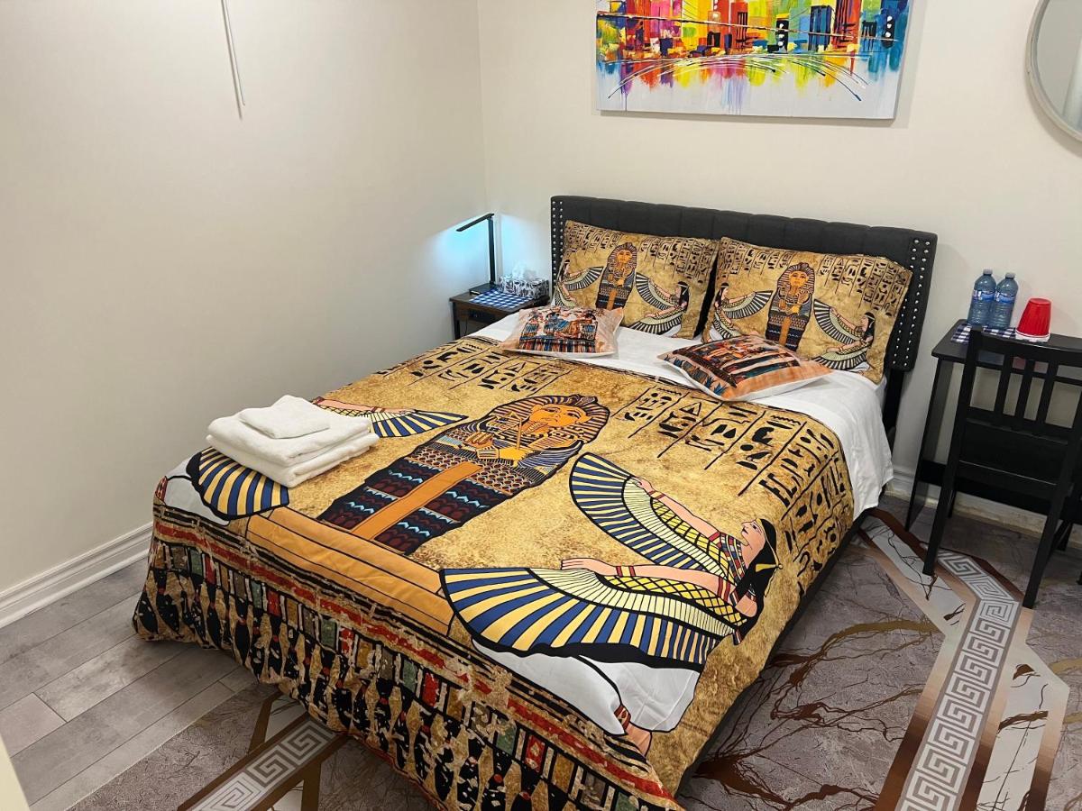 Stylish City Escape Toronto homestay, Deluxe Double bedroom with Egyptian-themed bedding